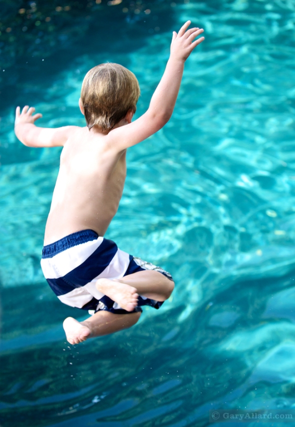 Boy jumping into the pool © GaryAllard.com